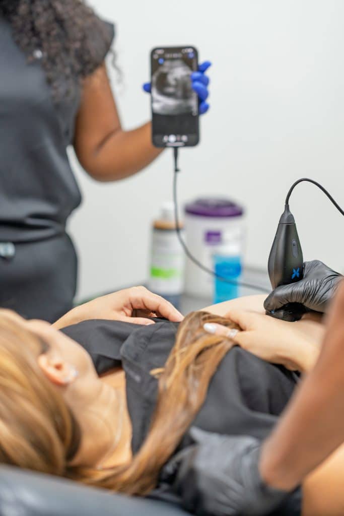 TrufaMED physician reviewing ultrasound results with a patient in Surfside Miami Beach